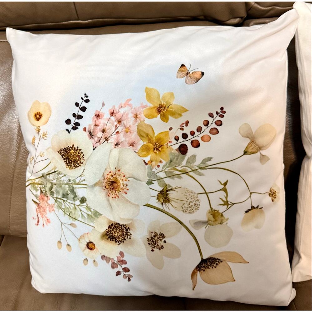 Two white throw pillows featuring a watercolor-style vintage wildflowers NEW